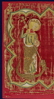 St. Margaret gets medieval on a dragon's ass. It's a metaphor for childbirth. (Detail of a panel from a burse held in the V&A Museum, made in England 1320-40)